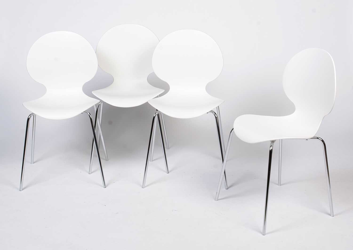 Galvano Tecnica: four Italian white plastic shell chairs.