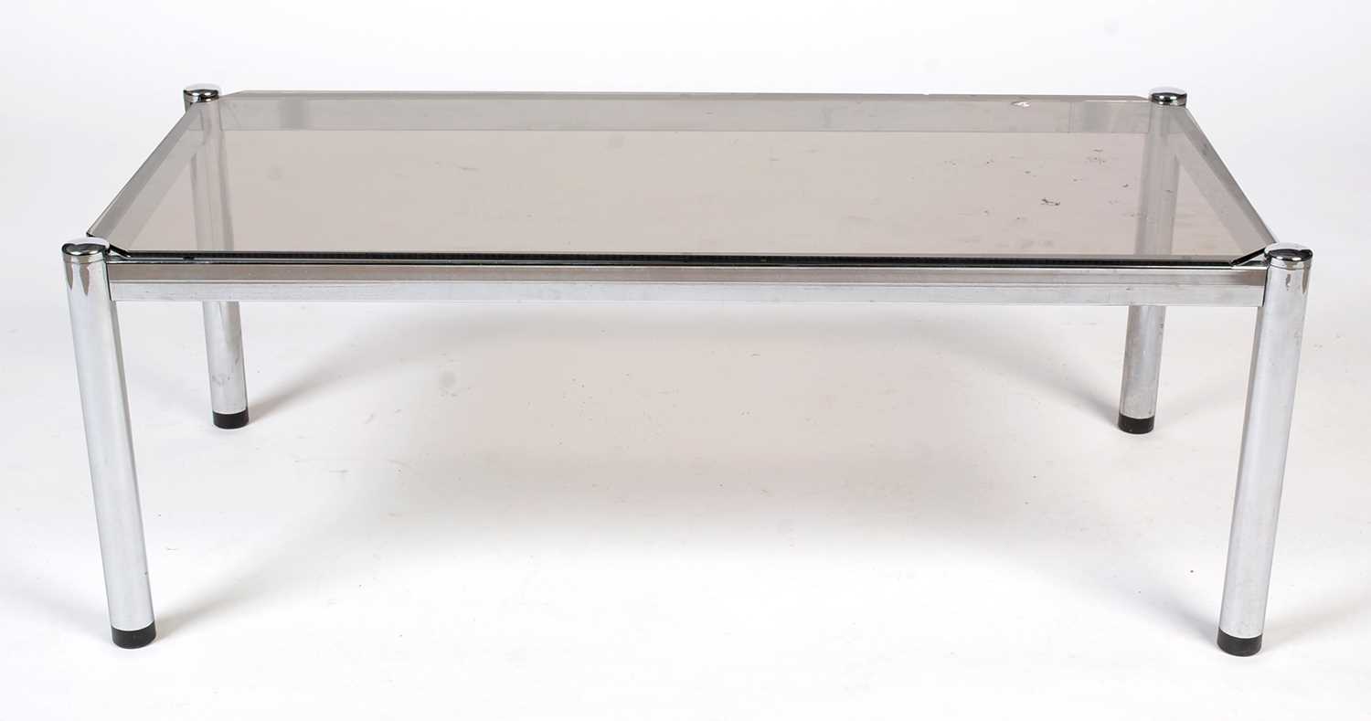 A mid century smoked glass and chrome metal rectangular coffee table