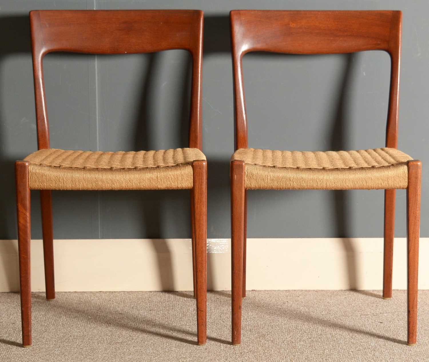 Svegards, Sweden: a pair of teak dining chairs.
