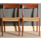 Svegards, Sweden: a pair of teak dining chairs.
