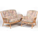 Ercol; a beech framed 'Jubilee' two seater settee, and matching easy chair.