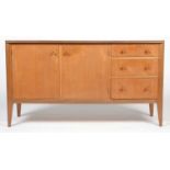 Storys, London; a mid-Century walnut sideboard,