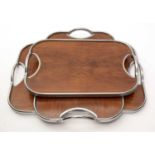 A graduated set of three Art Deco two-handled trays.