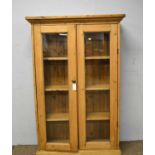 A 20th Century stripped pine bookcase.