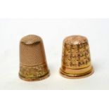 Two 15ct yellow gold thimbles.