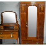 An Edwardian inlaid mahogany wardrobe.