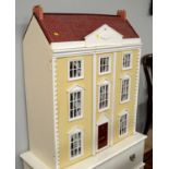 A mid-20th Century three storey dolls house.