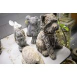 A selection of stone composite and other animal garden ornaments.