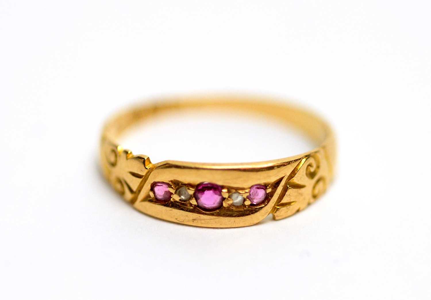 A ruby and diamond 18ct yellow gold ring,