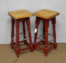 A pair of beechwood bar stools.