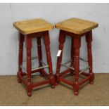 A pair of beechwood bar stools.