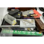 A selection of drawing instruments and tools.