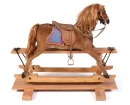 A 19th Century German skin covered rocking horse