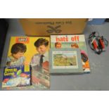 A selection of mid-20th Century board games and toys.