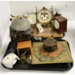 A collection of clocks, clock parts, and accessories