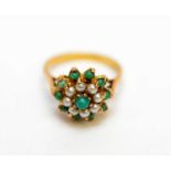 A turquoise and half pearl cluster ring,