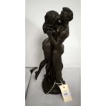 A contemporary bronzed figure group of an embracing couple.