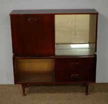 A mid-20th Century stained wood drinks cabinet