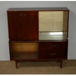 A mid-20th Century stained wood drinks cabinet