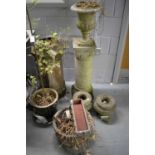 A selection of stone composite garden planters and accessories.