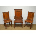 Three early 20th Century mahogany hall chairs.