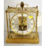 A Junghans brass-cased anti-climatic electronic mantel clock