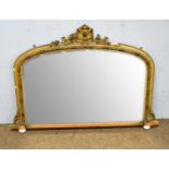 A gilt framed overmantel mirror.