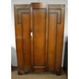 An Art Deco carved oak wardrobe