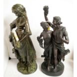 A bronzed spelter figure group of a couple; and a bronzed figure of a lady.