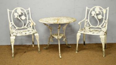 A white painted garden table and two chairs.