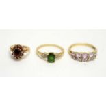 Three gem stone set rings.