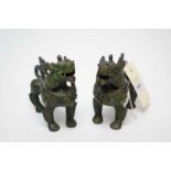 A pair of late 20th Century Chinese cast metal fo dog