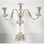 A silver-plated three-branch candelabra.