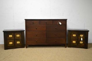 A modern chest of drawers; and a pair of bedside chests.