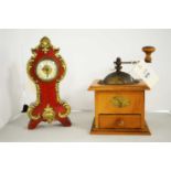 A vintage coffee grinder; together with a miniature mantel clock