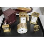 A selection of Victorian and later brass-cased clocks.