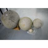 Three stone composite spheres.