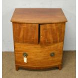 A Georgian mahogany bowfront commode cabinet.