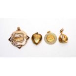 Four yellow metal pendants