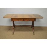 A Regency mahogany and brass inlaid sofa table.