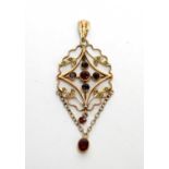 An Edwardian 9ct gold, garnet and seed pearl openwork pendant