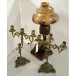 A pair of brass figural candelabra, together with a carved weight table lamp