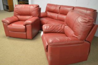 A DFS red leather three-piece suite.
