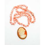 Cameo brooch and coral necklace.