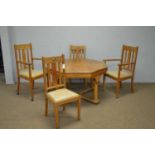 An early 20th C centre table; and four dining chairs.