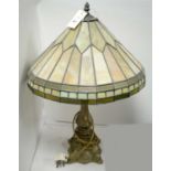 A 20th Century Tiffany style gilt lamp with leaded shade.