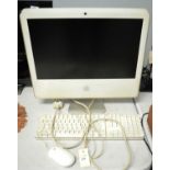 An Apple iMac desktop computer and keyboard and mouse
