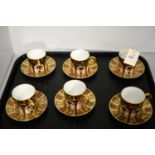 A set of Royal Crown Derby Imari pattern coffee cups and saucers
