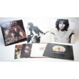 7 Rock LPs by Queen, Springsteen, and the Doors