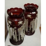 A pair of Victorian cranberry glass lustres.